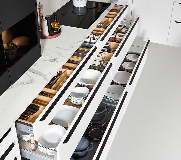 a nobilia kitchen with drawers pulled out